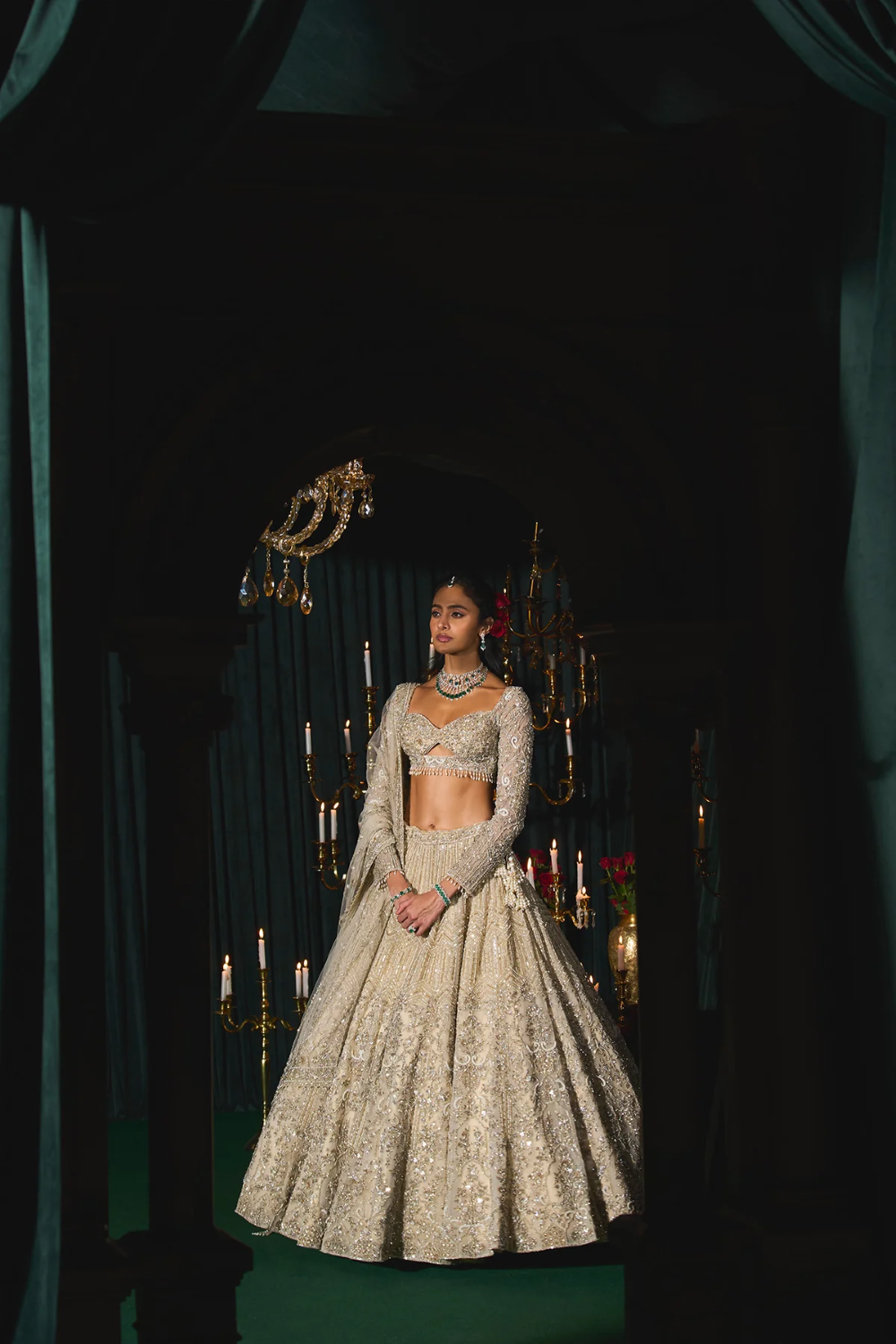 Ivory net lehenga embroidered with sequins and cutdana
