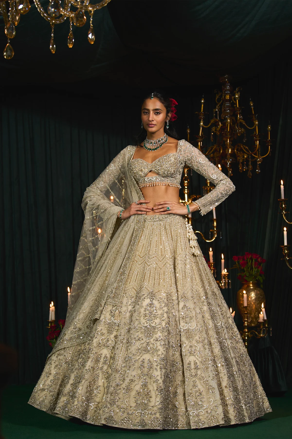 Ivory net lehenga embroidered with sequins and cutdana